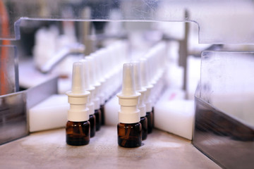The production line of the medicine. Filling interferon in bottl
