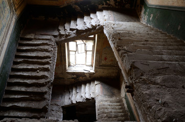 Fototapeta na wymiar Ruined stairs and window inside old abandoned house,Odessa,Ukraine,Europe