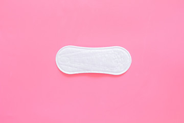 Woman hygiene protection. Sanitary pads on pink background top view copy space pattern