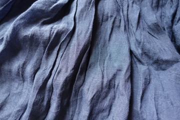 Blue cotton and polyester fabric in soft folds