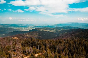 Beautiful summer mountain landscape, in the blue sky a lot of big white clouds