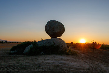 landscape with a round rock