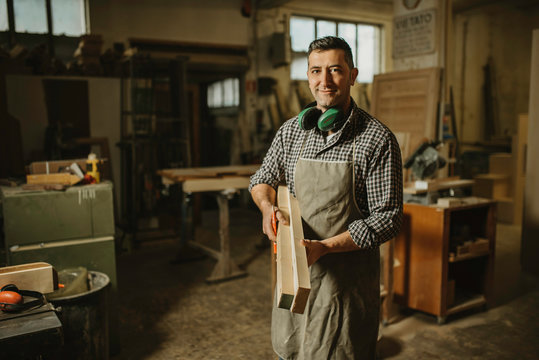 Image of mature carpenter in the workshop