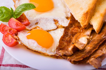 Breakfast with bacon and fried eggs