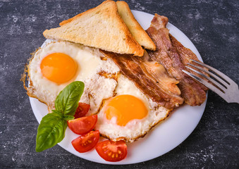 Breakfast with bacon and fried eggs