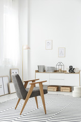 White sideboard in stylish interior