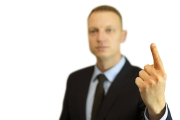 a young and handsome businessman pointing up with his finger