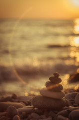 stack of zen stones on pebble beach