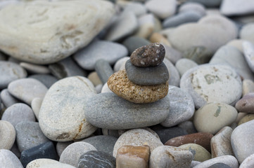 Fototapeta na wymiar stack of zen stones on pebble beach