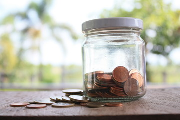 saving coins in glass jar