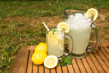 Pitcher and Glass of Lemonade Outside