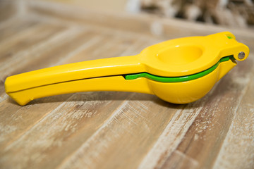 Lemon Squeezer  on wooden background.