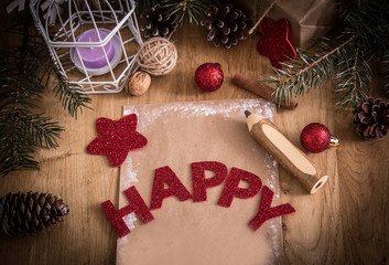 greeting card,pencil,candle and Christmas decoration on wooden b