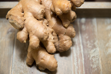 Fresh ginger root on the wooden table