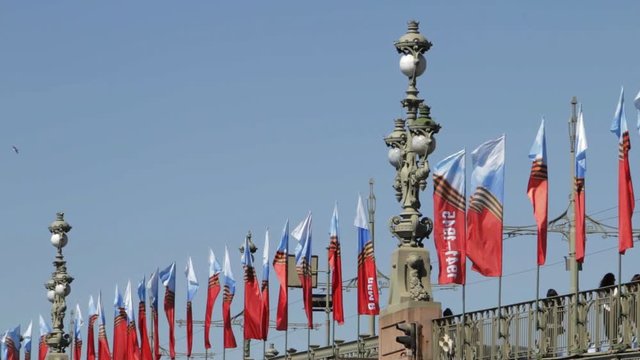 Saint Petersburg, Russia - May, 2018: Decorated Troitsky bridge, Victory day celebration. Flags waving in the wind.
