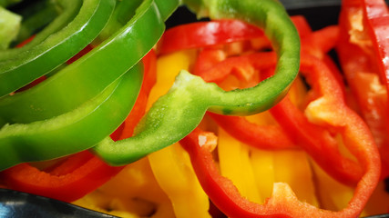 Bell pepper or paprika in green ,red and yellow in basket at market.