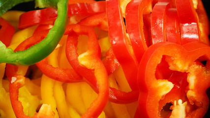 Bell pepper or paprika in green ,red and yellow in basket at market.