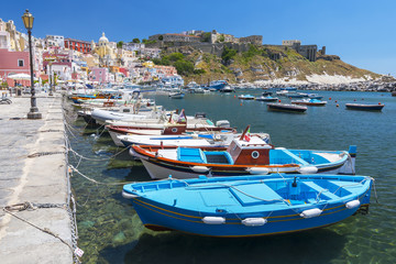 Fototapeta na wymiar Marina Corricella with colourful boats and houses, Terra Murata, Procida Island, Bay of Naples, Italy.