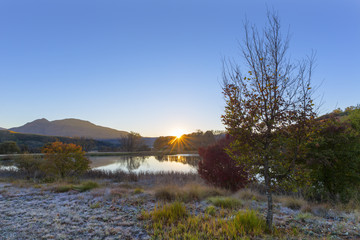 Sunrise at the water in autumn