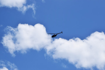 Fototapeta na wymiar helicopter on the sky
