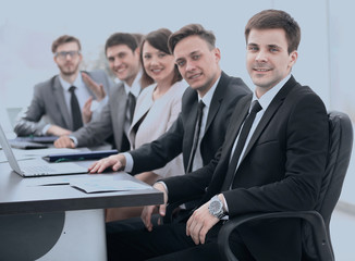 project Manager and professional business team sitting at Desk