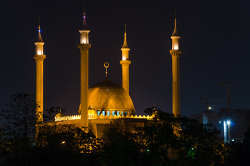 The National Mosque of Abuja illuminated during the night