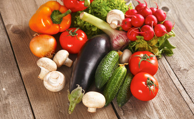 Pile of organic vegetables on a wooden table