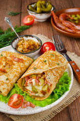Savory pancakes stuffed with mashed potatoes, pickles and bacon
