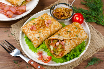 Savory pancakes stuffed with mashed potatoes, pickles and bacon