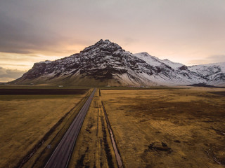 Empty road through wide open space in Iceland
