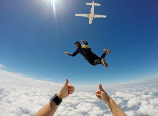 Skydiver Cloudscape jump out of plane - 205410823