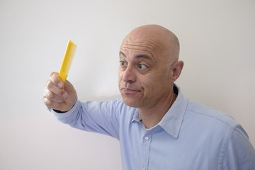 bald man with comb