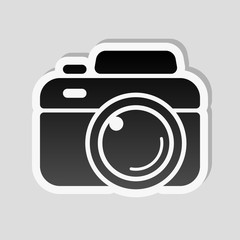 Photo camera, simple icon. Sticker style with white border and s