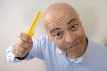 bald man with comb
