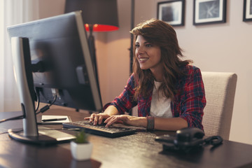 Fototapeta na wymiar Female programmer working in a home office