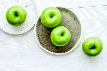 green apples for healthy dessert on white background top view