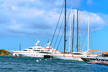 Fototapeta na wymiar Sea and Luxury yachts at marina of Porto Cervo Sardinia