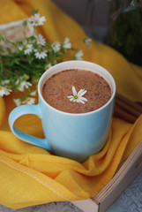 Blue Cup of Coffee Milk Latte Drink Cinnamon Sticks Wooden Background Yellow Napkin Rustic Camomile Flower Buquet Flat Lay