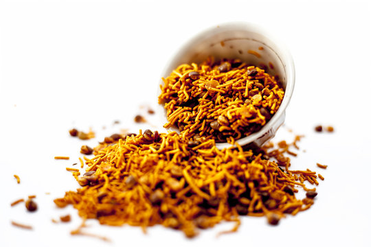 Popular Indian & Gujarati dish Dal muth or DAL MOOTH in a glass bowl isolated white eaten as a fast food snack, appetizer and  as a junk food also.