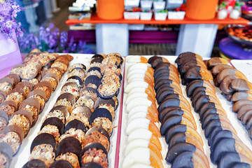 Glass shop window with handmade pastry Zurich