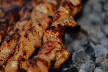 We cook shish kebab on the grill in the open air