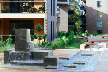 Fountain at architectural complex of apartment residential buildings