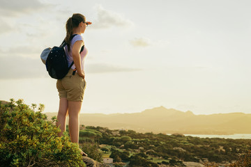 Young girl looking sunrise in resort Mediterranean