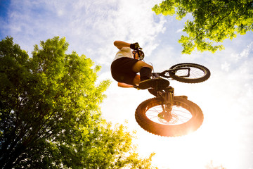Young cyclist extreme jump