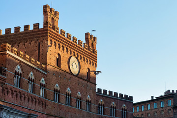 Fototapeta na wymiar Town Hall on Piazza del Campo Square in Siena