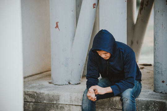 Portrait of asian man sad,drug addict man sitting on the floor,flakka drug,zombie drug