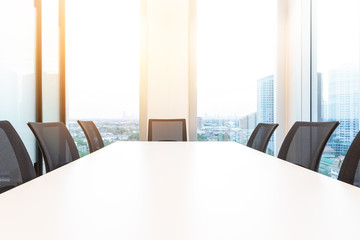 Modern meeting room with for present, large windows outside building, city, tower view, soft focus