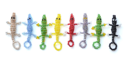 Alligators of different colors. Products from beads. Crocodiles in the technique of weaving with...
