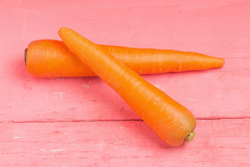 carrot on pink wood
