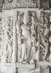 Fototapeta na wymiar Ancient Architectural Ornament, Stone Carving Decorations Inside Ranakpur Jain Temple in Rajasthan, India